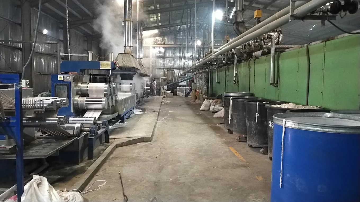 Wide panorama of staple fiber manufacturing floor and draw line