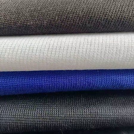Stacked stitch-bound interlining fabrics in multiple color grades