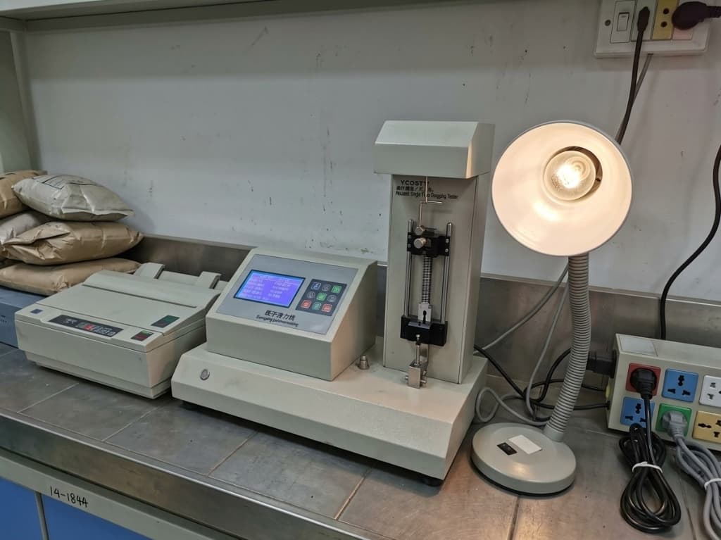 Electronic single fiber tensile gauging tester in Gulf Fiber laboratory
